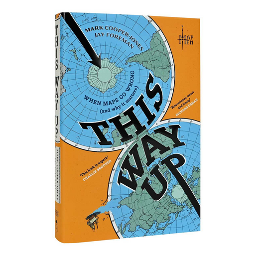 This is a clean studio shot of the book 'This Way Up' by Mark Cooper-Jones and Jay Foreman, published by Map Tien. The book cover features a bold orange background with three stylized blue world maps arranged in a circle, intersected by a black arrow pointing to the center.