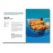 A printed recipe card or magazine page showing a prepared food photo of macaroni cheese on toasted bread in a blue basket, with text titled 'mac câis' and additional recipe instructions on a white page.