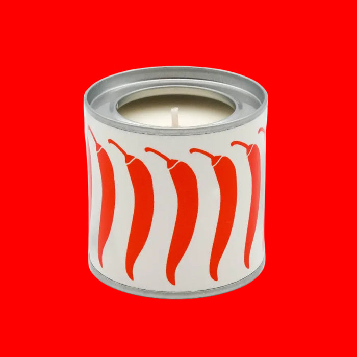 Candle in a can with red and white design on a white background