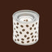Candle in a tin with coffee bean pattern on a white background