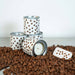 Candle holders with coffee bean design on a bed of coffee beans