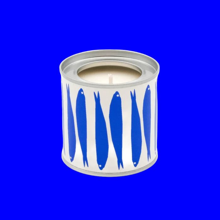 Candle in a can with blue fish design on a white background