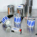 Metal cans with blue patterns on a reflective surface