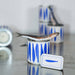 Tin can with blue fish pattern and a small fish on a reflective surface.