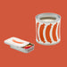 Candle in a decorative tin with sausage illustrations on a white background