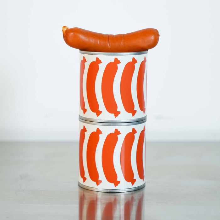 Two stacked cylindrical containers with a red sausage pattern on a white background