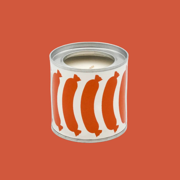 Candle in a can with orange sausage design on a white background