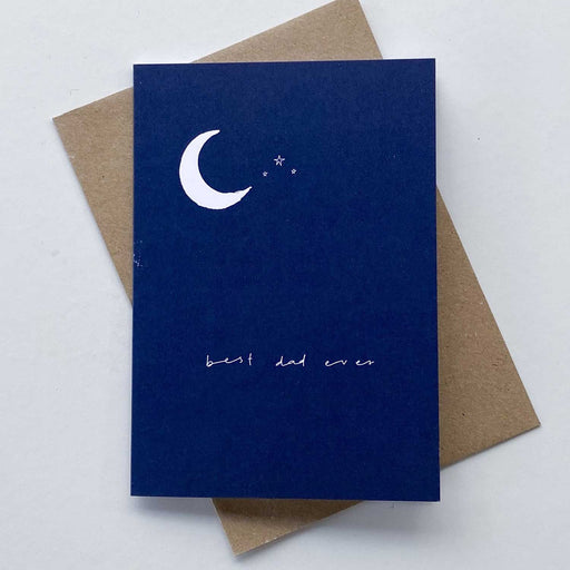 blue greeting card with best dad ever written in cursive text and white crescent moon with three stars in upper left corner