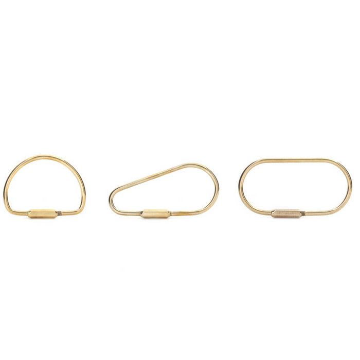 three brass wire keyrings. one D shaped, one teardrop shaped and one oblong shaped