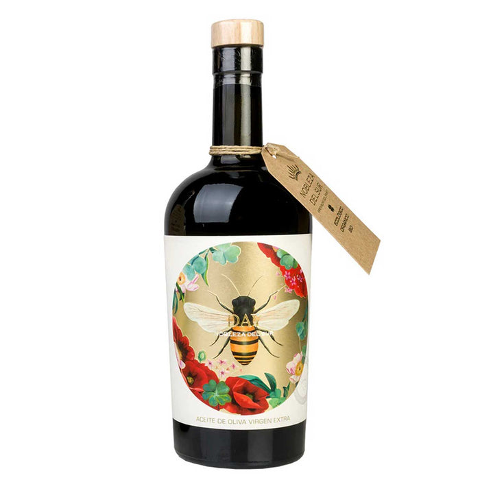 BROWN BOTTLE WITH WITH AND GOLD LABEL WITH RED FLOWERS AND A BEE ON FRONT