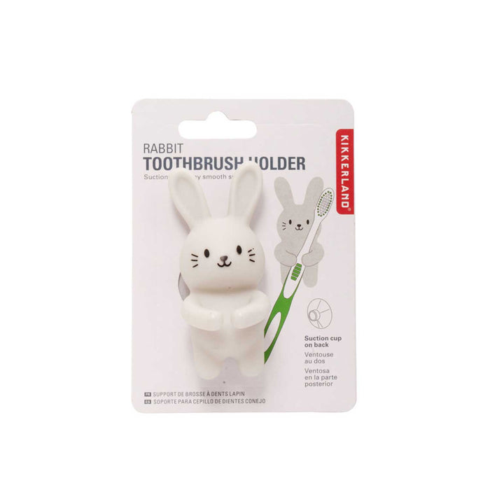 White rabbit toothbrush holder attached to  a product  backing board