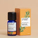 Rosemary essential oil blue bottle beside an orange product box with an illustration of a rosemary leaf on front