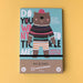 Do you want to tickle me activity pack with illustration of a bear in a pink hat on front against a yellow background