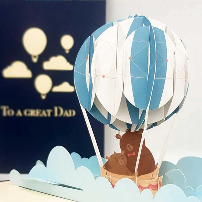 blue and white paper 3d model of a balloon with a baby bear and big bear inside and a blue card in the background which says to a great dad