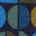 dark blue wool pattern with mustard, light blue and green semi circles