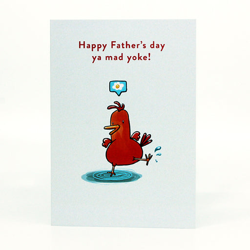 fathers day card on white background. cartoon of orange chicken standing on one leg in a puddle and a bubble above its head with an egg inside. red text above the chicken