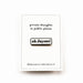 white backing card with black text and white enamel pin with 'ah jaysus!' in black on a white background