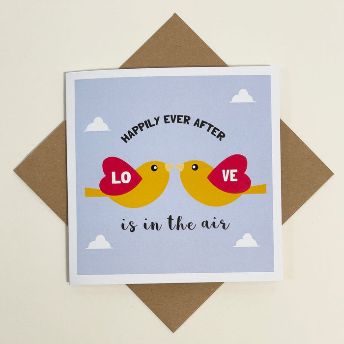 square card with with birds on it with the text 'happily ever after love is in the air'