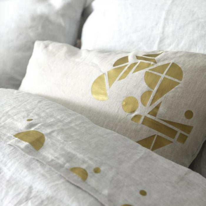 gold patches on grey bedding