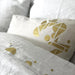 gold patches on grey bedding