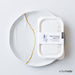 the new kintsugi repair kit sitting on top of a large white plate with a gold seam
