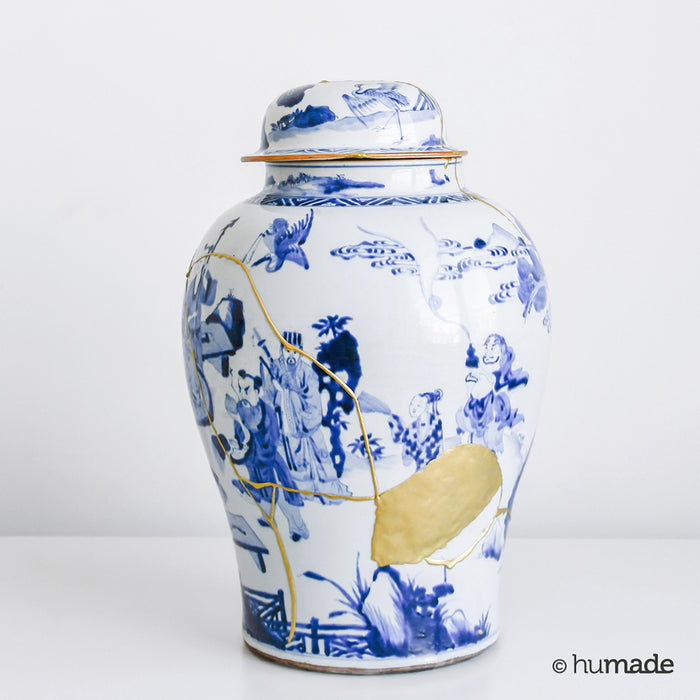 white and blue vase with gold repair from the new kintsugi kit