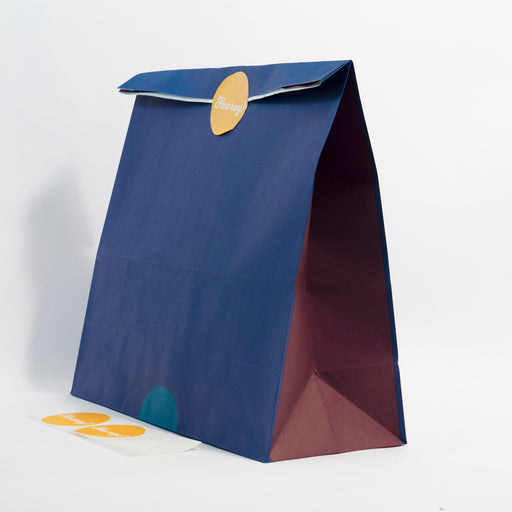 large reusable gift bag - navy with plum sides. with yellow sticker that says 'hooray!'