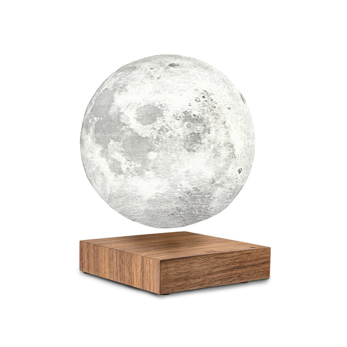 smart moon lamp hovering above wooden base in front of white background