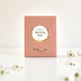 A pink rectangular product box with a circular white and beige label reading 'flavours of Sparkling Rose' and smaller text 'The Real Wine Gum Wine Design,' photographed on a light surface with flowers scattered.